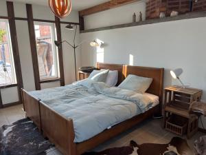 Postel nebo postele na pokoji v ubytování Loft by Conceptliving