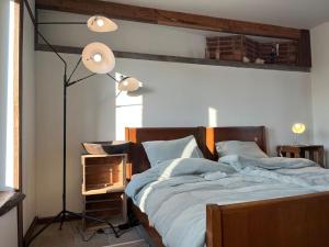 Postel nebo postele na pokoji v ubytování Loft by Conceptliving