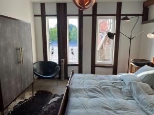 Postel nebo postele na pokoji v ubytování Loft by Conceptliving