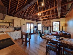 a kitchen and living room with a table and chairs at Chandlers Rest 