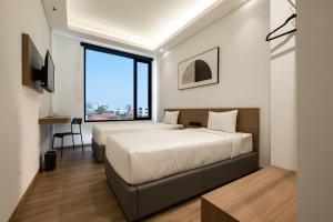 Katil atau katil-katil dalam bilik di Assa Hotel
