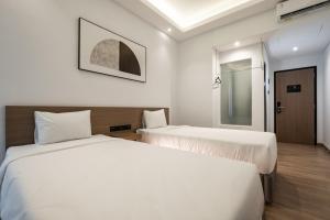 Katil atau katil-katil dalam bilik di Assa Hotel