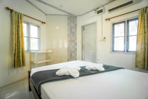 Postel nebo postele na pokoji v ubytování Slumber Party Koh Tao