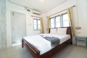 Postel nebo postele na pokoji v ubytování Slumber Party Koh Tao
