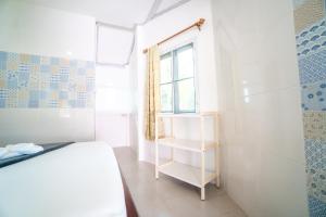Postel nebo postele na pokoji v ubytování Slumber Party Koh Tao