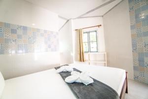 Postel nebo postele na pokoji v ubytování Slumber Party Koh Tao