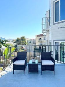 a patio with two chairs and a table on a balcony at Stunning apartment steps from Ocean Beach in San Francisco