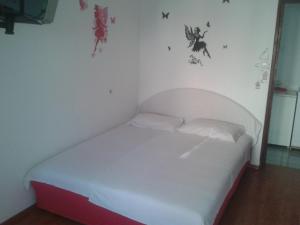 Postel nebo postele na pokoji v ubytování Guest House Vila Jasna