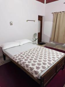 a large bed in a room with a mattressvisor at The Clift in Varkala