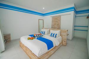 Postel nebo postele na pokoji v ubytování Kura Kura Divers Lodge