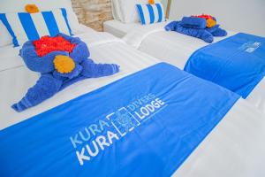 Postel nebo postele na pokoji v ubytování Kura Kura Divers Lodge