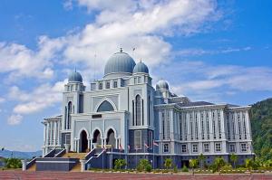 a large white building with domes on top of it at Homestay Ira Jaya - 4 Unit Rumah in Kangar