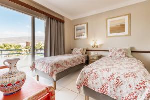 Posteľ alebo postele v izbe v ubytovaní Club Atlantis Aparthotel Ocean View