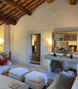 a living room with a couch and a fireplace at PodereVicoBasso Siena in Siena