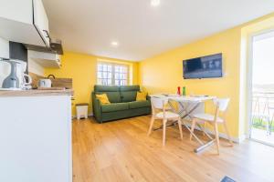 TV a/nebo společenská místnost v ubytování Les chevrefeuilles Appartement en residence