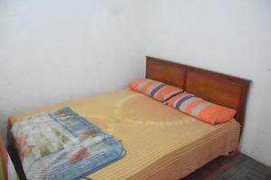 Postel nebo postele na pokoji v ubytování Maharagama Shehan Hotel