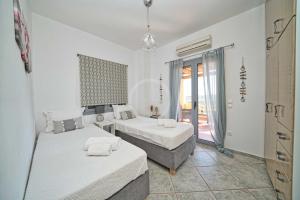 Postel nebo postele na pokoji v ubytování Villa Clementine