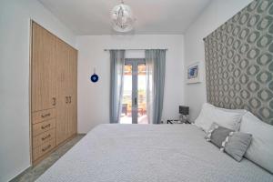 Postel nebo postele na pokoji v ubytování Villa Clementine