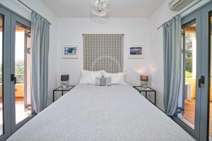 Postel nebo postele na pokoji v ubytování Villa Clementine