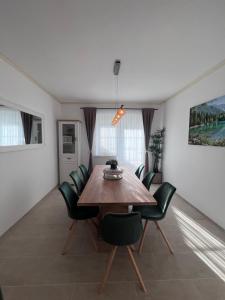 a dining room with a wooden table and chairs at Ferienhaus Purgar in Kammern im Liesingtal