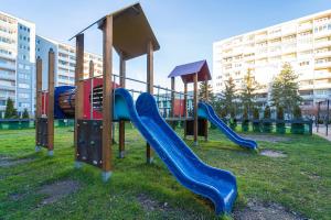 a playground with a slide in a park at Penzion Set in Košice