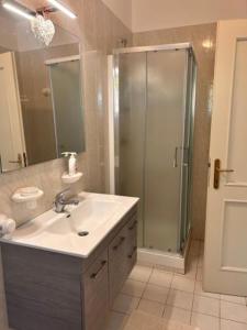 a bathroom with a sink and a shower at VILLA MONTESOLE in Lecco