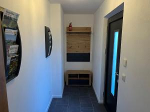 a hallway with a room with a door and a room with at Bayerwaldapartment in Viechtach