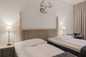 Postel nebo postele na pokoji v ubytování Hotel Bishops Arms Piteå