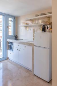 Kuchyň nebo kuchyňský kout v ubytování Manus Dei Exclusive Suites