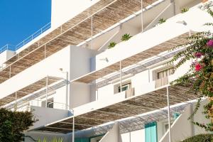 an external view of a building with balconies at Hotel Cala Dor - Adults Only in Cala d´Or