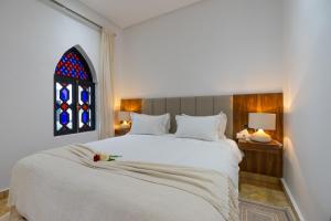 Postel nebo postele na pokoji v ubytování The Grand Riad and Spa