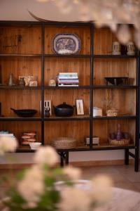 a shelf with bowls and other items on it at Villa Can Rasca in Caimari