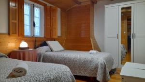 Giường trong phòng chung tại Casa de Piñeiro y SPA Opcional de +31 ảnh