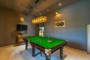a billiard room with a green pool table at The Artist House Udaipur in Udaipur