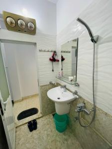 a bathroom with a sink and a shower at GM Homestay in Hai Phong