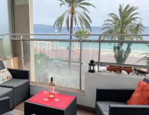 a living room with a view of the ocean at La Prom 2 - a two bedroom apartment with a sea view in Nice