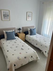 Posteľ alebo postele v izbe v ubytovaní Casa Aloe