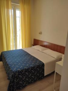 Postel nebo postele na pokoji v ubytování Hotel Sissi