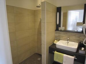 Ванна кімната в Landhotel zum grünen Kranze