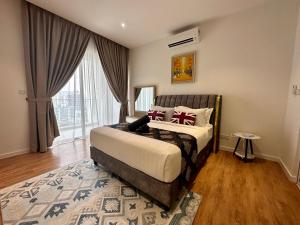 a bedroom with a bed and a large window at Heaven Cottage KLCC Suite in Kuala Lumpur