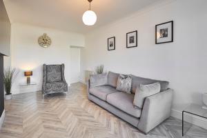 a living room with a couch and a chair at Host & Stay - Spring Cottage in West Rainton