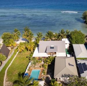 an aerial view of a house and the ocean at Hyde-Tide Guesthouse in La Digue