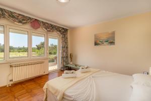 Postel nebo postele na pokoji v ubytování VILLA MARRY