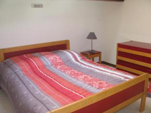 Cama o camas de una habitación en Au Songe Du Valier- Appartements