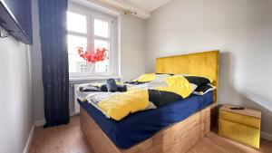Ένα ή περισσότερα κρεβάτια σε δωμάτιο στο Apartament Złoty w Opolu +6 φωτογραφίες