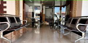 a row of empty chairs in a hair salon at HOTEL HUMA in Srinagar