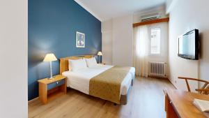 Postel nebo postele na pokoji v ubytování Lucy Hotel