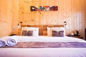 Aaryam Resort, Auliにあるベッド