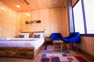 Aaryam Resort, Auliにあるベッド