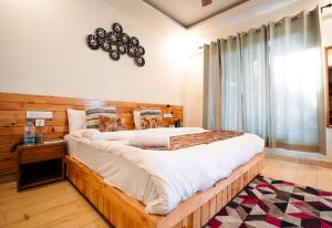 Aaryam Resort, Auliにあるベッド